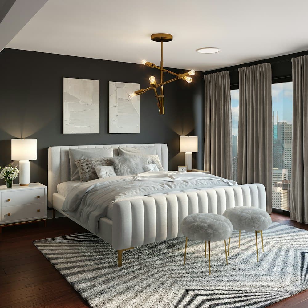 Master bedroom with upholstered bed and brass chandelier