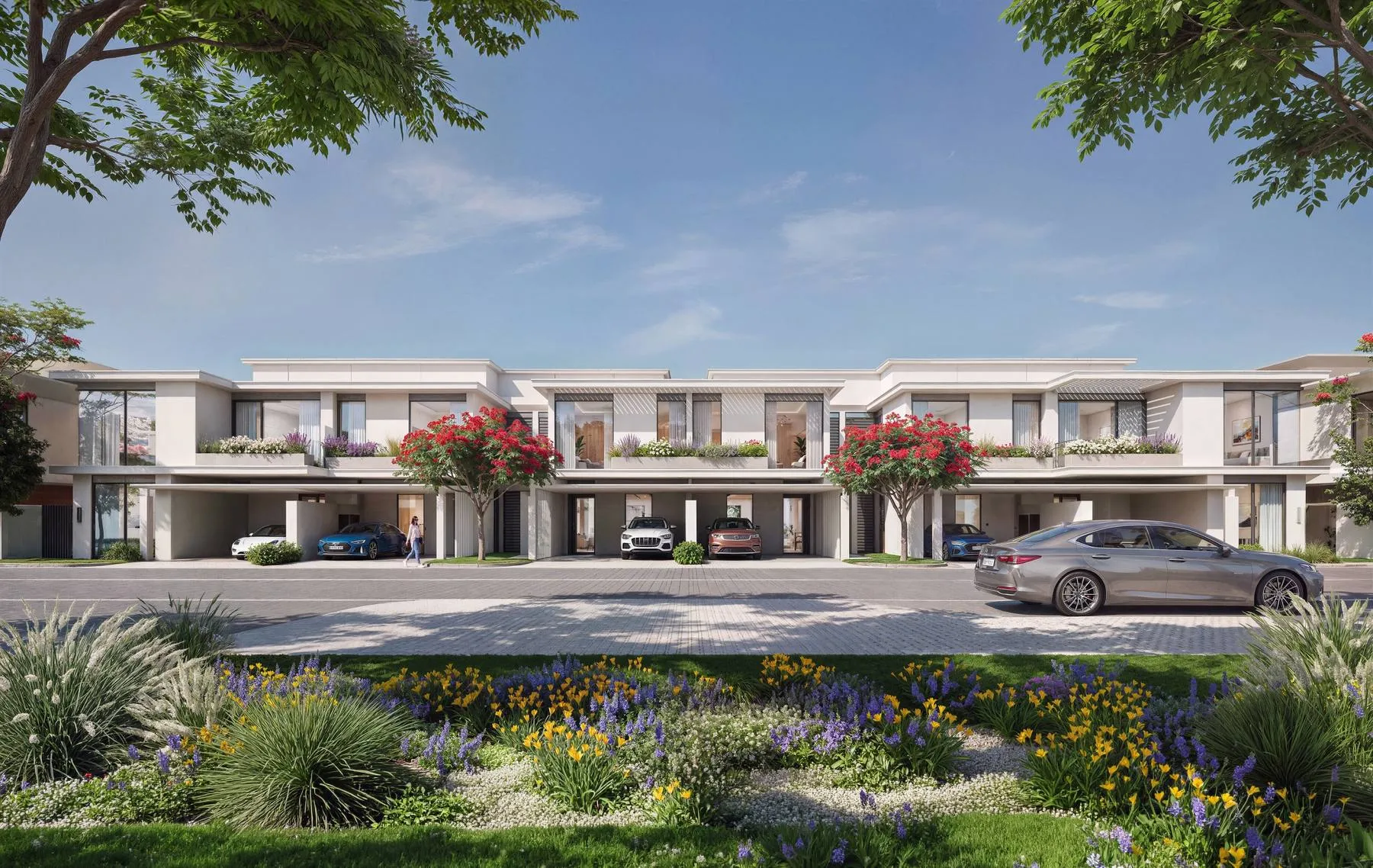 Row of townhouses behind a landscaped verge